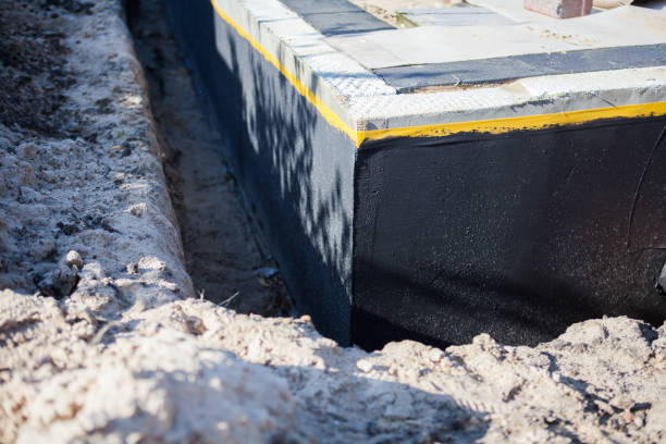 Professional Wet Basement Repair technician working in Midland, PA